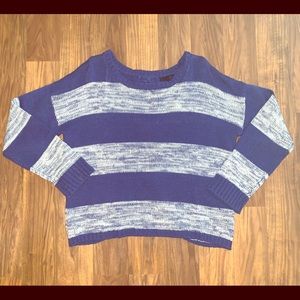 Sweater with bows down the back.